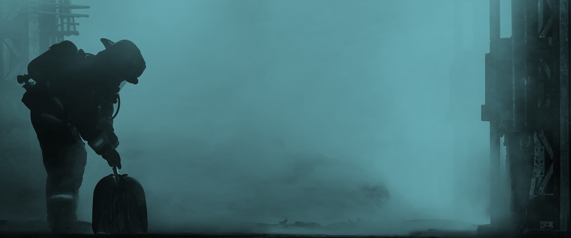 Silhouetted firefighter in full gear holding hose, standing in smoky teal-lit environment during operation.